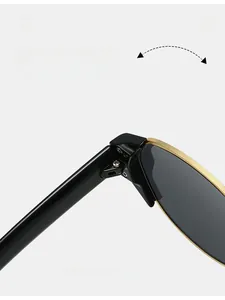 Detailed close-up of durable golden metal texture hinge on retro cat eye sunglasses