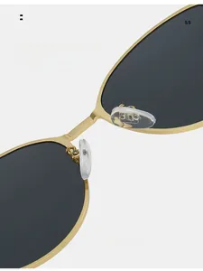 Close-up of soft silicone nose pads on gold metal frame cat-eye sunglasses