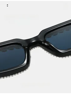 Close-up of comfortable nose pads on black square sunglasses with sparkling rhinestones