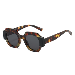 Retro oversized round tortoiseshell sunglasses with thick frames and dark lenses