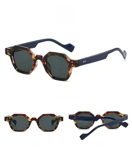 Three-way view of retro polygonal sunglasses with tortoiseshell frame and rivets