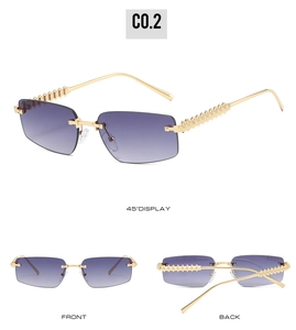 Detail view of purple gradient rimless sunglasses with punk-style gold spike studs on temples