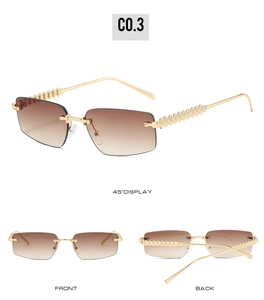 Detail view of rimless square sunglasses with brown gradient lenses and gold rivet temples