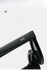 Detailed macro view of black resin hinge with silver rivet studs and glossy finish