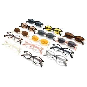 Multiple colors of vintage oval frame sunglasses displayed in a top-view array layout