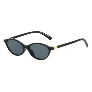 Stylish black oval frame sunglasses with golden hinge accents and grey lenses