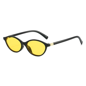 Oval black sunglasses with yellow lenses and gold pyramid rivets in 45-degree view