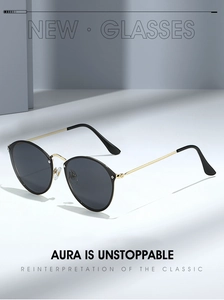 Detail of retro round sunglasses showing gold metal hinges and sleek black frames