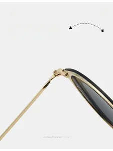 Detail shot of durable golden metal hinges on round frame vintage sunglasses