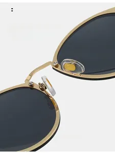 Detailed macro view of the comfortable nose pads on these vintage round metal sunglasses