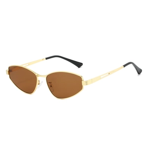 Irregular hexagonal gold metal sunglasses with brown lenses in retro minimalist style