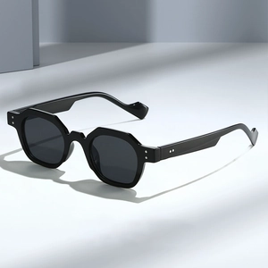 Retro polygon sunglasses with thick black frames and silver rivets in geometric setting
