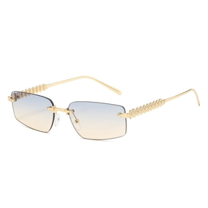 Fashion rimless sunglasses with gradient lenses and golden spiked rivets on the temples