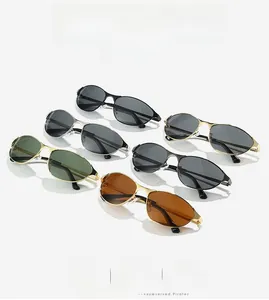 Collection of metal cat-eye sunglasses in multiple colors on a reflective grey surface