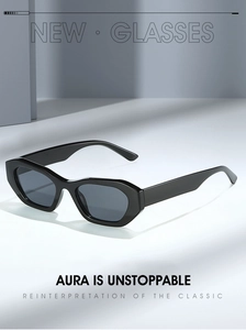 Macro shot of stylish black thick-frame geometric sunglasses with dark lenses