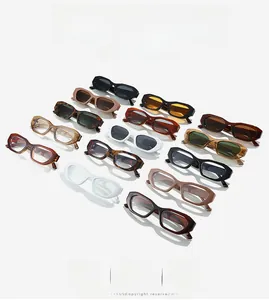 Flat lay collection of retro narrow frame sunglasses in multiple trendy color options
