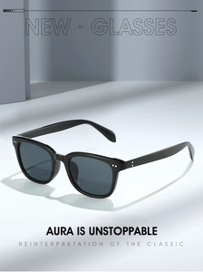 Close-up of classic black square sunglasses with silver metal dots and UV lenses