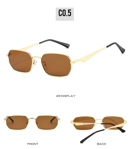 Details einer unregelmäßigen hexagonalen Sonnenbrille aus Goldmetall mit braunen Gläsern