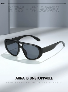 Détail de lunettes aviateur noires tendance avec monture épaisse et verres foncés