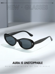 Detailed view of black oval sunglasses featuring silver metal accents on the temple frame