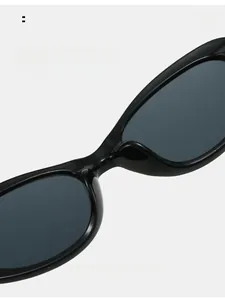 Detail of integrated nose pads on black oval sunglasses for comfortable all-day wear
