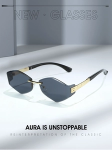 Detail of rimless geometric sunglasses featuring gold metal temples and engraved hinges