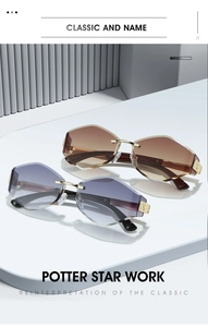 Close-up of rimless geometric sunglasses with gold metal temples and embossed hinges