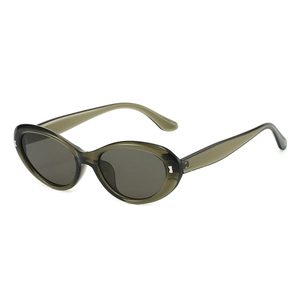 Vintage oval sunglasses with olive green transparent frames and silver bow details