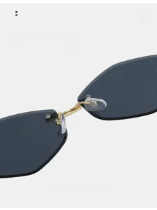 Close-up of ergonomic silicone nose pads and gold metal bridge on rimless sunglasses