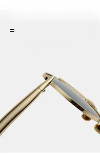 Detail showing the polished golden metal hinge and lightweight frame of these sunglasses