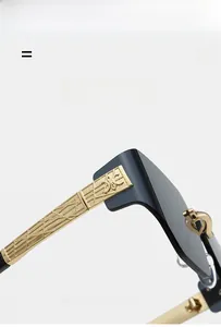 Detailed close-up of golden metal temple hinges and textured logo on rimless sunglasses