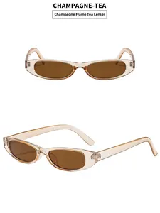 Detail view of champagne vintage oval sunglasses with brown lenses and slim frames
