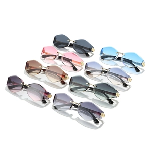 Octagonal rimless sunglasses with gradient lenses and ornate gold metal temples