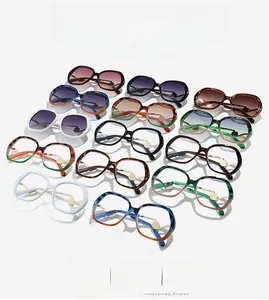 Detail view of large frame sunglasses in various colors like tortoise and gradient tones