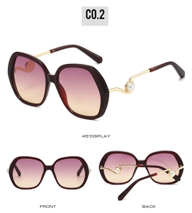 Detailed views of wine red oversized sunglasses with pearl accents and gold metal temples