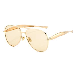 Retro aviator sunglasses with gold metal frame and yellow tinted lenses on white background