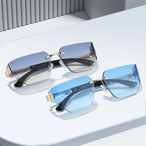 Modern rimless geometric gradient sunglasses with gold metal bridge and black temples