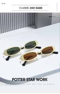 Détails de petites lunettes de soleil en métal rétro avec verres verts et ambrés sur fond