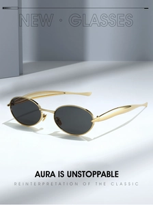 Detail of gold metal temples and oval frame on minimalist premium fashion sunglasses