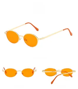 Detailed view of oval sunglasses with gold metal frames and orange lenses from multiple angles