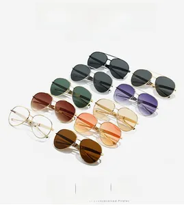 Collection of aviator sunglasses with gold metal frames and diverse colored lenses
