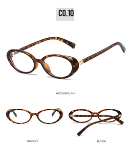 Detail view of oval tortoise shell frames with gold metal accents in multiple angles
