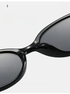 Close-up of comfortable integrated nose pads on black oval sunglasses for women