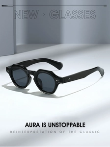 Detail view of vintage thick black round sunglasses with decorative silver rivets