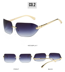 Detail view of rimless purple gradient sunglasses with golden bamboo-style metal temples