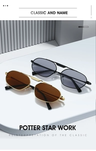 Detail view of gold and black irregular geometric sunglasses on a white pedestal display