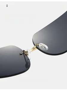 Detail view of comfortable silicone nose pads and golden metal bridge on rimless sunglasses