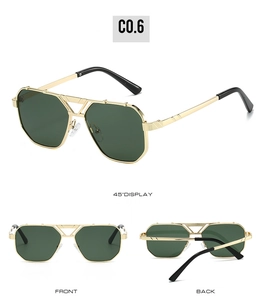 Detail view showing gold polygonal metal frame and dark green lenses of square sunglasses
