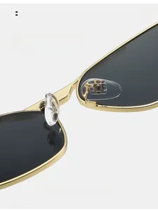 Close-up of comfortable silicone nose pads on gold irregular polygon sunglasses