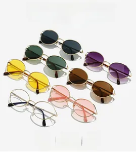 Detailed arrangement of retro metal oval sunglasses in multiple lens colors and gold frames